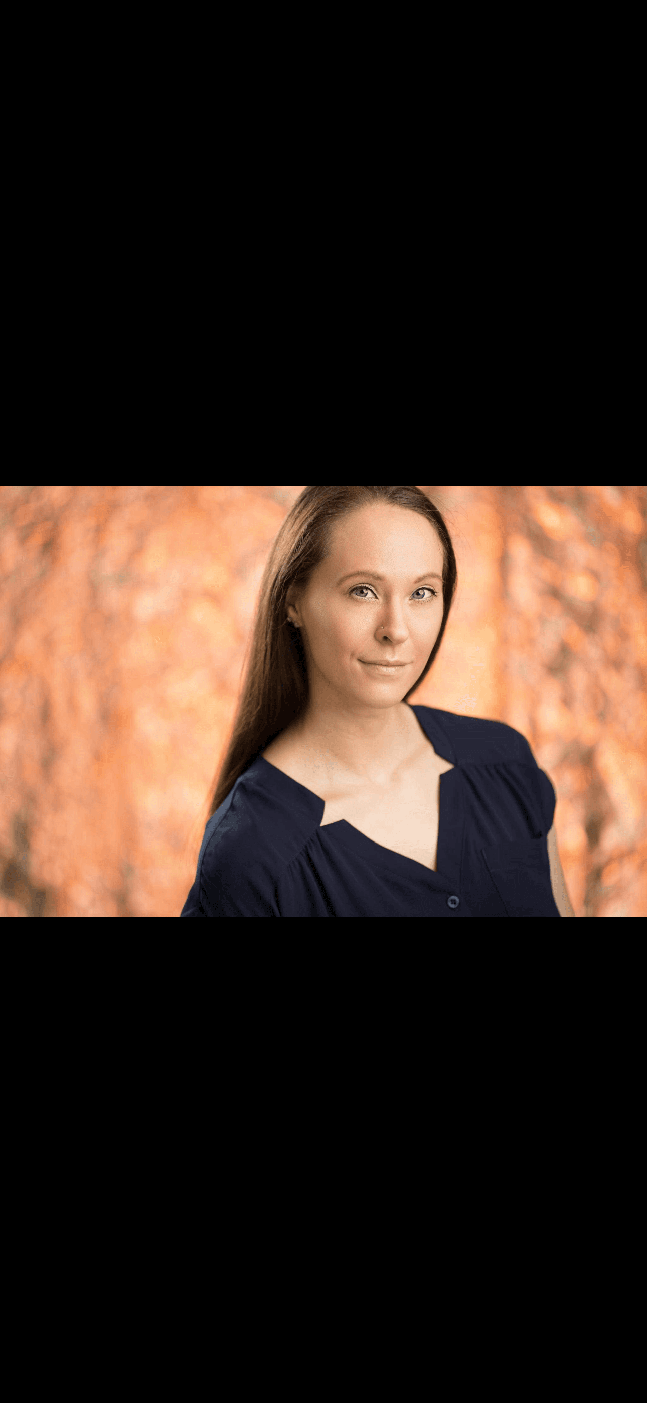Andrea Abella Marie, lifestyle and wellness coach, in a navy blouse